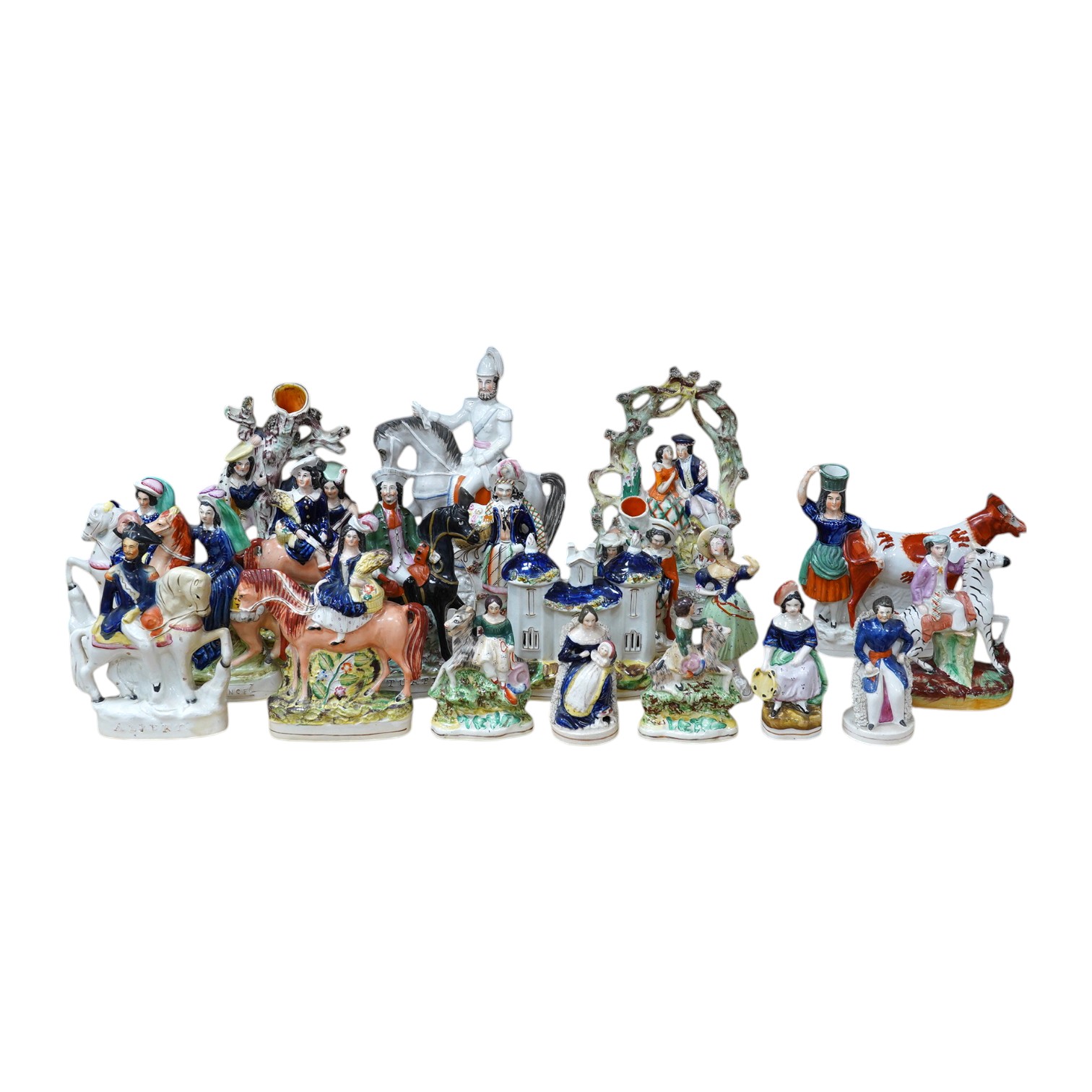 A collection of twenty Staffordshire flatback figures or models to include D. Turpin and Empress of France, largest 36cm high. Condition - fair, some restored